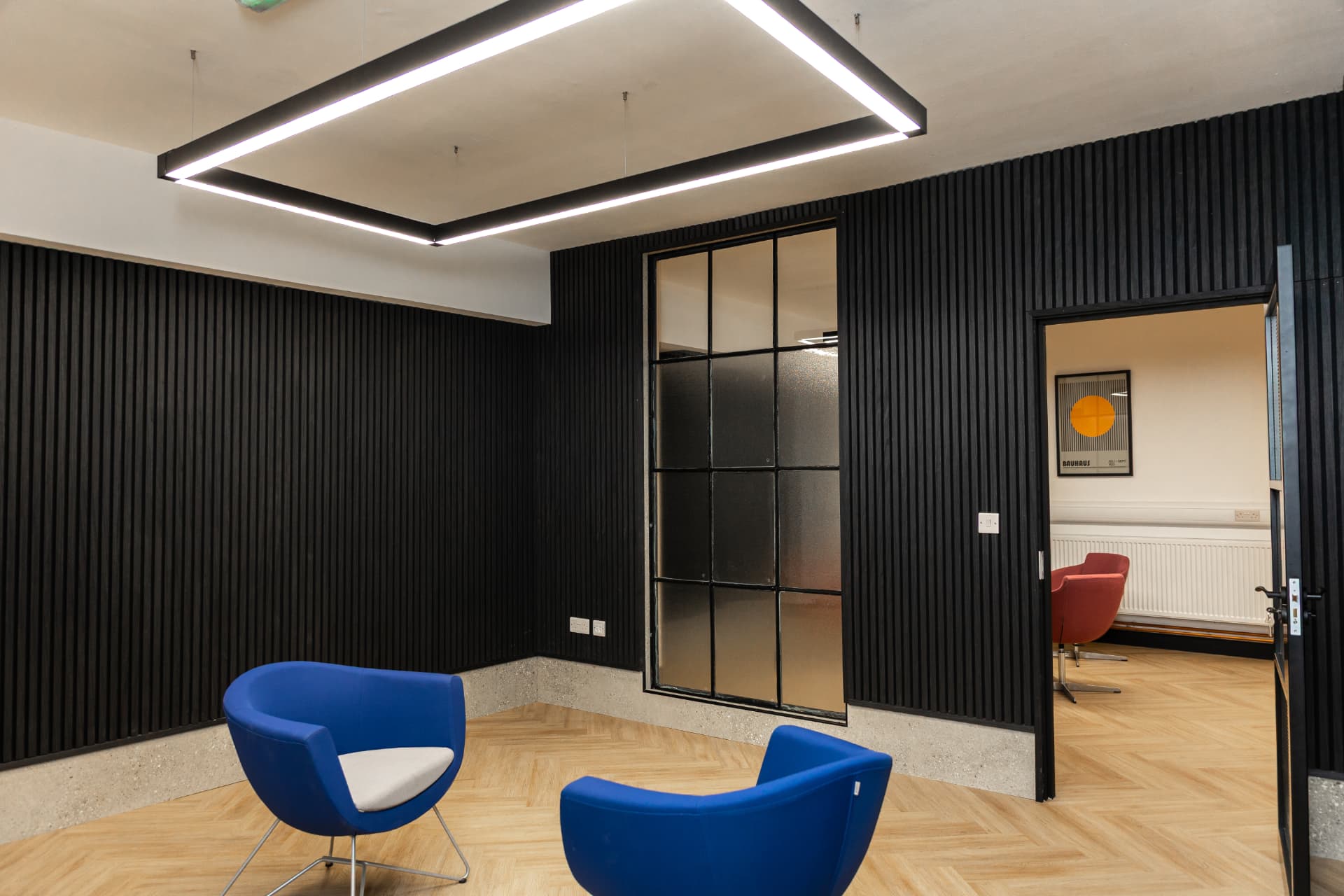 Medium room at Workpoint with modern furniture and an open doorway